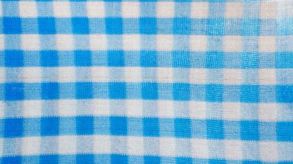 Blue And White Checkered Fabric Texture Background For Design and copy space.