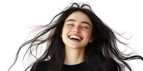 Radiant young woman with long flowing dark hair laughing joyfully, expressive natural portrait on black background