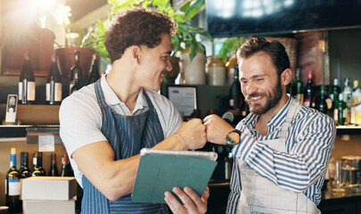 Waiter, team and tablet in restaurant with fist bump, positive online review and happy for order...