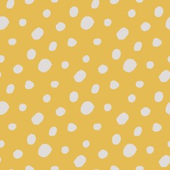 seamless pattern with white polka dots on yellow background 