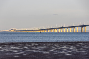 Fototapeta premium Vasco da gama bridge crossing tagus river in lisbon, portugal at sunset