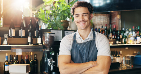 Man, waiter and arms crossed with smile at pub with pride, confident or small business owner at restaurant. Person, server and portrait with career, catering or happy with liquor at bar in Costa Rica