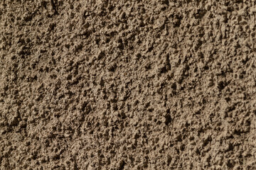 A detailed closeup shot of a rough gray wall texture, which is ideal for use as backgrounds or in various design projects