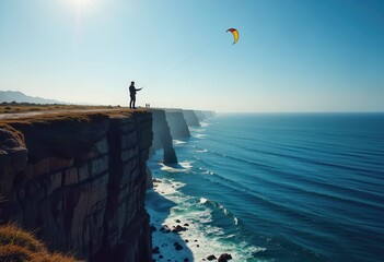 Naklejka premium Kite surfing on a rugged cliff overlooking the ocean during a clear day