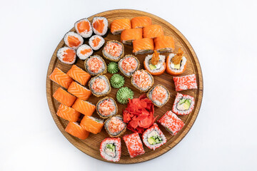 Sushi roll with salmon, avocado and cucumber on white background