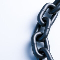 Obraz premium close up of interlocking metal chains against neutral background, showcasing strength and industrial design
