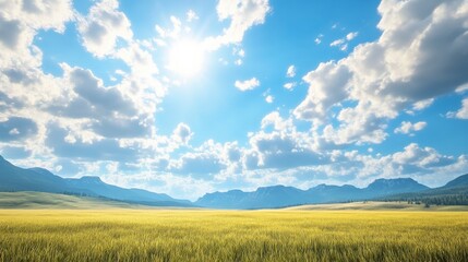 Obraz premium Sunny day landscape of a golden wheat field extending to a mountain range under a vibrant blue sky with fluffy white clouds. The sun shines brightly, casting a warm, idyllic glow over the scene.