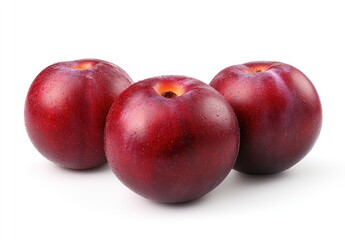 Obraz premium Fresh Red Plums with Water Droplets on White Background for Healthy Eating and Nutrition Concepts