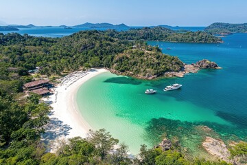Naklejka premium Picturesque island beach with turquoise water, surrounded by lush greenery and rocky outcrops Tranquil scene of a secluded paradise, with boats anchored in the bay