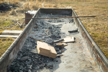 Dirty empty barbecue grill in outdoors.