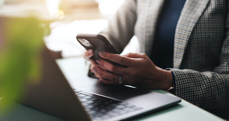 Hands, business and woman in office, smartphone and laptop with social media, texting and internet....