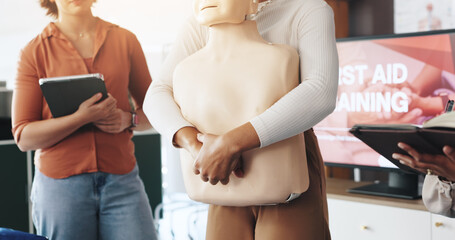 First aid, training and hands with choking dummy for CPR, abdominal thrusts and life saving...