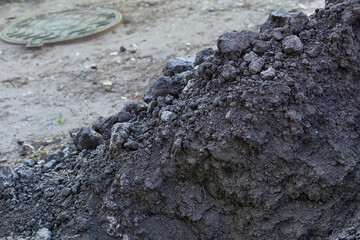 A pile of fertile soil for adding to lawns