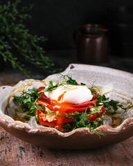 A Colorful and Delicious Dish Featuring a Poached Egg Accompanied