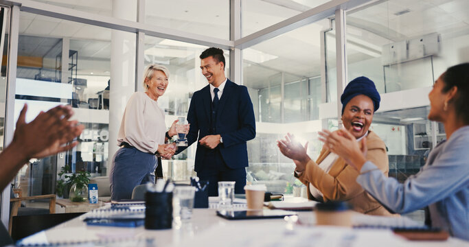 Applause, success and award with business people in meeting for trophy, achievement and deal. Promotion, congratulation and handshake with group of employees in office for profit, bonus and winner