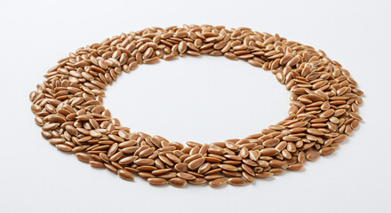 Obraz premium pile of flax seeds arranged in oval shape on white background. generative ai