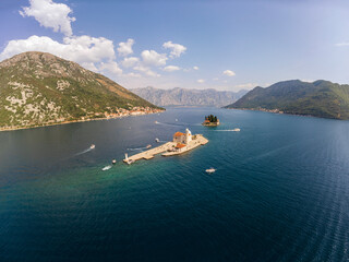 Top view of the island near Perast of the church of our lady of the rocks. Aerial landscape of tourist attraction in the Bay of Kotor, Montenegro