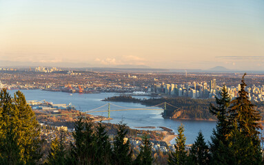 Fototapeta premium Vancouver city downtown panorama. Vancouver Harbour marina aerial view at dusk. Lions Gate Bridge, British Columbia, Canada.