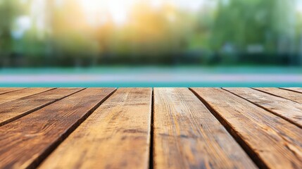 Fototapeta premium Rustic wooden table overlooking blurred running track in scenic outdoor setting