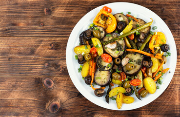Tasty grilled vegetables on wooden surface, vegetarian food.