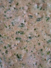 Green mixture of herbs and spices in a bowl ready for cooking in the kitchen