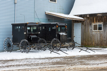 A horse drawn Mennonite carriage parked in rural Ontario on a winter afternoon.