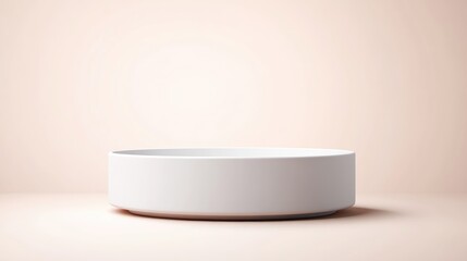 Empty, round, white ceramic bowl on pastel peach background