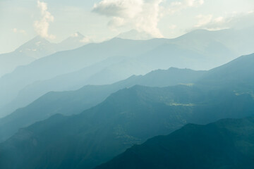 View of the mountains and blue sky with clouds at sunset. Dagestan, Russia.
