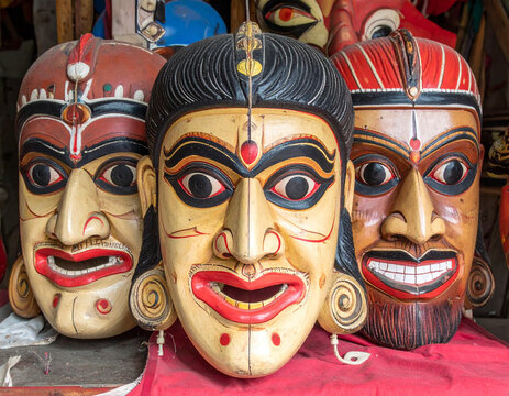 Traditional Chhau dance masks, with their expressive faces and vibrant colors, are displayed, representing the folk dance tradition of Eastern India and its mythological storytelling.