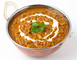 A steaming bowl of flavorful dal makhani, a popular lentil dish from North India, garnished with cream and cilantro, is presented.