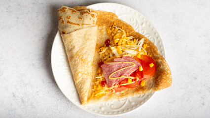 oatmeal pancakes with salted salmon, cucumber, greens and curd cheese