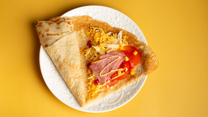 oatmeal pancakes with salted salmon, cucumber, greens and curd cheese