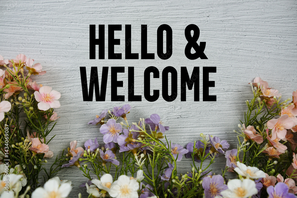 Poster hello and welcome text with flowers frame on concrete background