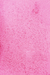 Abstract background with pink and white speckles.