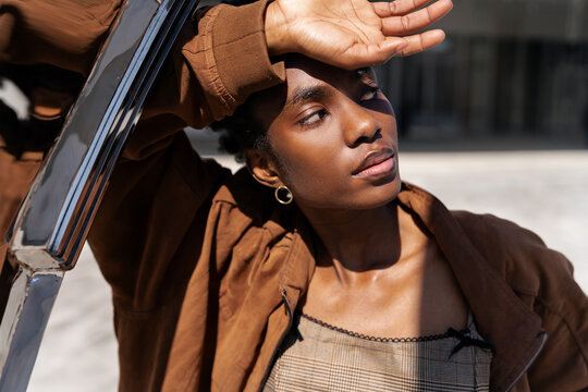 Contemporary Portrait: Youth, Style, and Identity in Urban Landscape. Beautiful portrait of a girl looking away