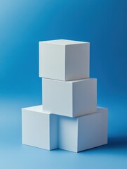 Obraz premium Stacked white cubes against a blue background creating a minimalist geometric composition with soft lighting and a clean modern aesthetic for product display