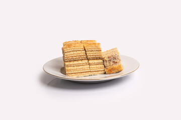 sweet layered cake on white plate.