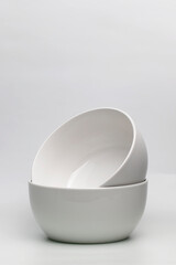 Two white ceramic cups on a white background