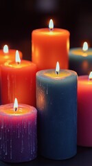 Illuminated candles with vibrant colors and gentle flames creating a warm cozy atmosphere perfect for relaxation and peaceful moments at night