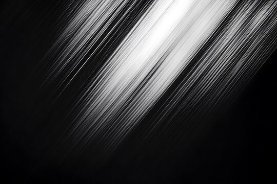 Black and white motion blur with diagonal lines creating an abstract texture on a dark background.