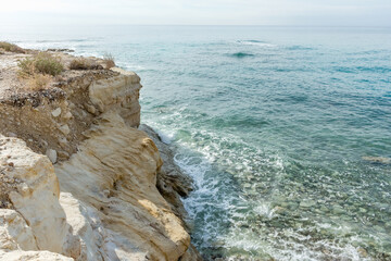 rocky beach in Cyprus and splashing waves