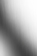 Sleek brushed metal texture with elegant gradient light ideal for modern design projects and industrial backgrounds creating a sophisticated metallic surface