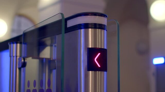 A turnstile gate shows green and red indicators for effective control of entry and exit points