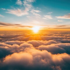 Obraz premium Aerial view of a breathtaking sunrise over a sea of clouds with vibrant orange and blue hues creating a serene and majestic atmosphere from a high angle perspective