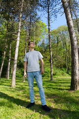 Man contemplating in beautiful forest 