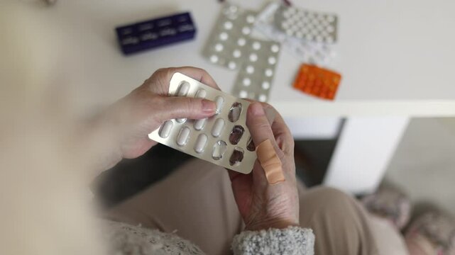 Senior woman taking her medication