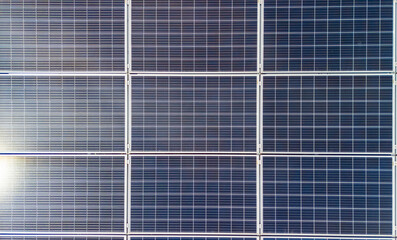 Solar panels arranged in a grid pattern, capturing sunlight for energy generation. Ideal for...