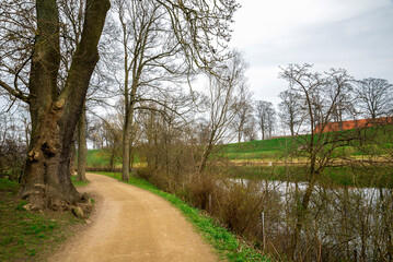 Scenic Dirt Path by a Moat Wind Across Kastellet Fortress Complex, Copenhagen, Denmark, 16 April 2018