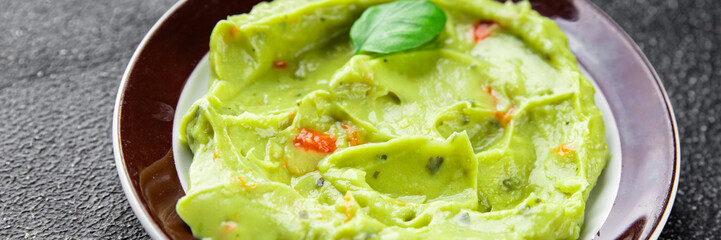 Guacamole dip avocado sauce cold appetizer vegetable pate dish organic product fresh tasty gourmet food background on the table rustic food top view copy space 