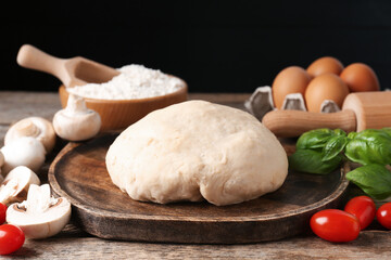 Making pizza. Different ingredients on wooden table, closeup